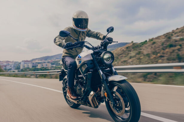 A 2020 Yamaha XSR700 motorcycle rides along a European freeway