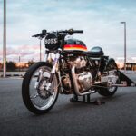 A Royal Enfield 650 Twin drag bike in a Sydney car park at sunset