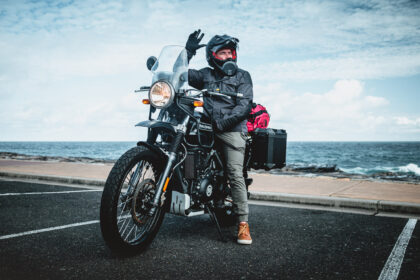 Daniel 'Beardy' McLaughlin on a Royal Enfield Himalayan at Bondi Beach