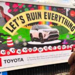 Climate activists use subvertising billboards to call out Toyota and BMW for greenwashing, anti-climate lobbying